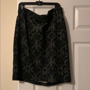 Knee length dressy black -rose patterned skirt.